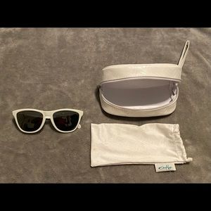Women’s Oakley Frogskins, bag, and soft case.